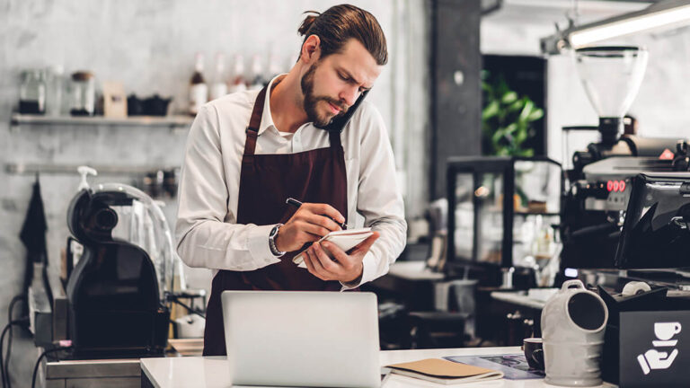 Barista taking an order over the phone.