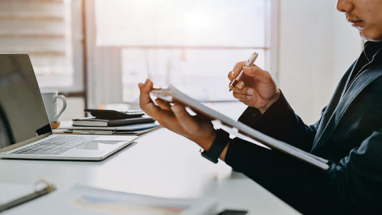Man reviewing allowable business expenses.