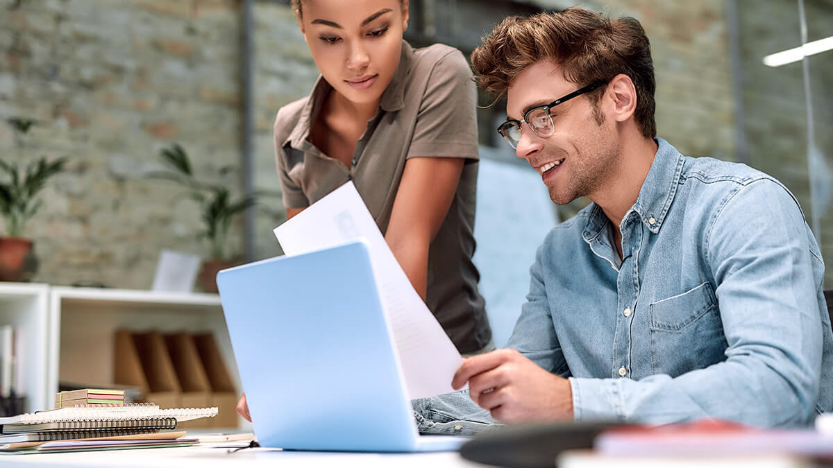 Man and woman working on articles of organization.