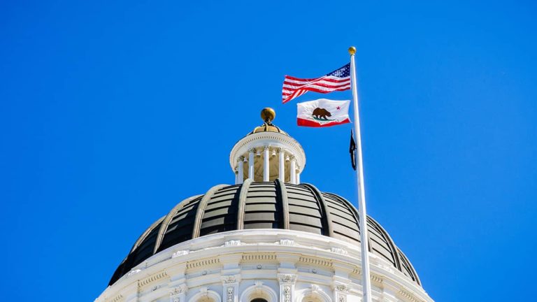 Government building flying the American and California flags.