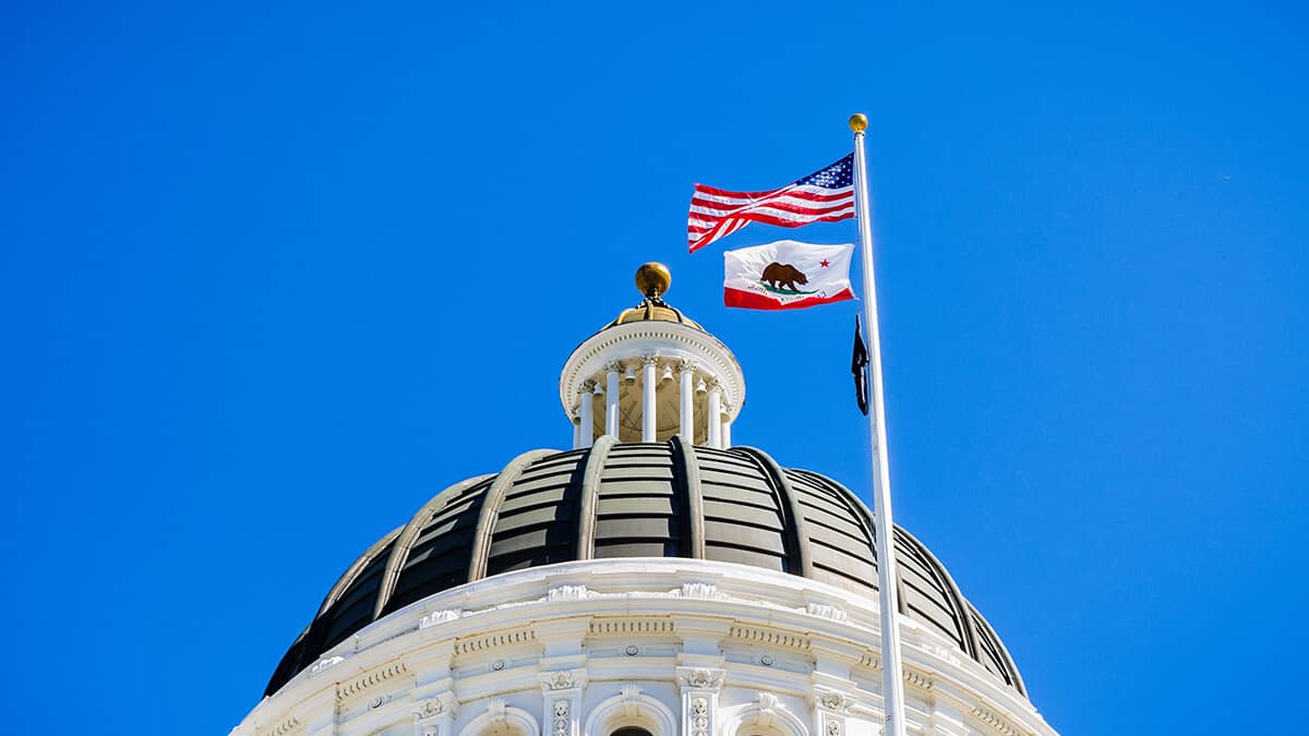 Government building flying the American and California flags.