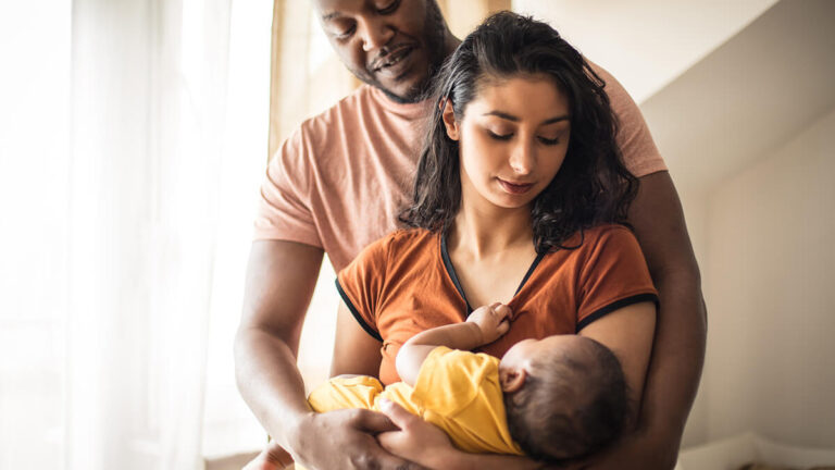 Parents holding newborn.