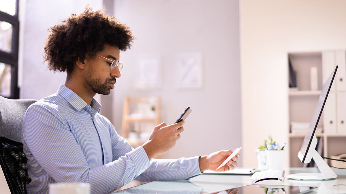 Man looking at his cell phone.