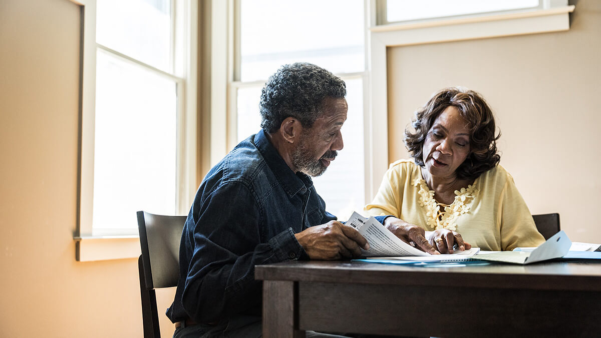 Retired couple discussing MyCTSavings.