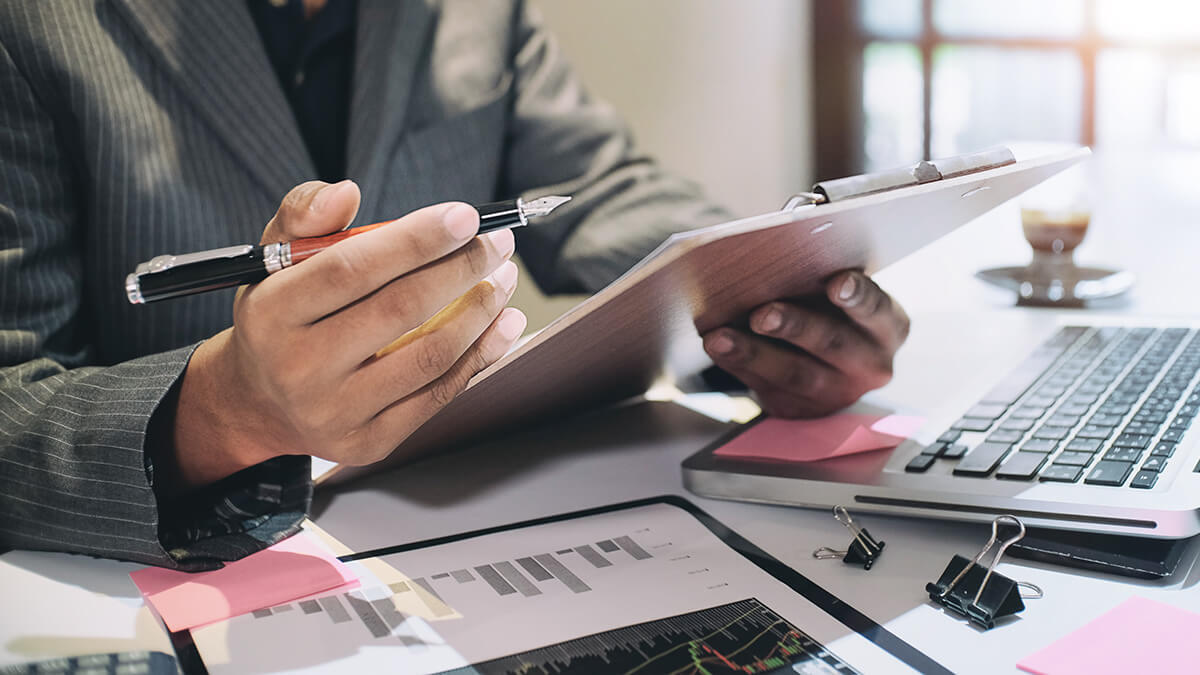 Business owner holding a clipboard.