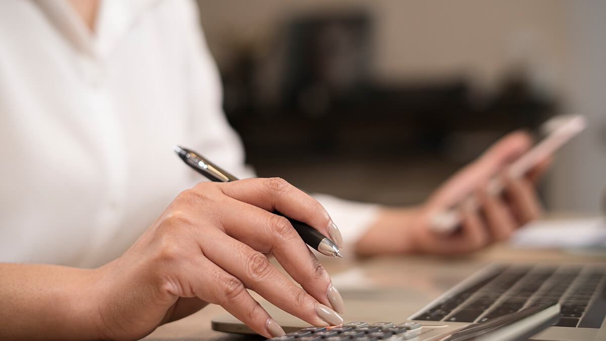 Employer doing payroll by hand.