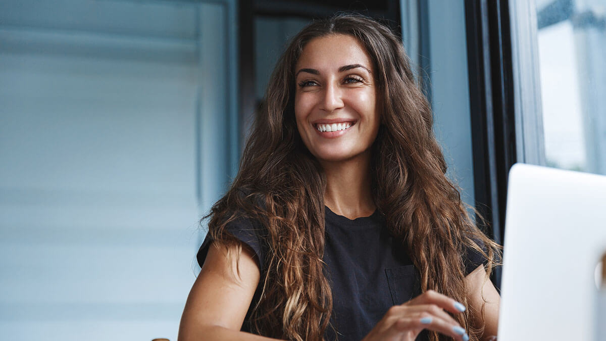 Woman smiling in the distance.