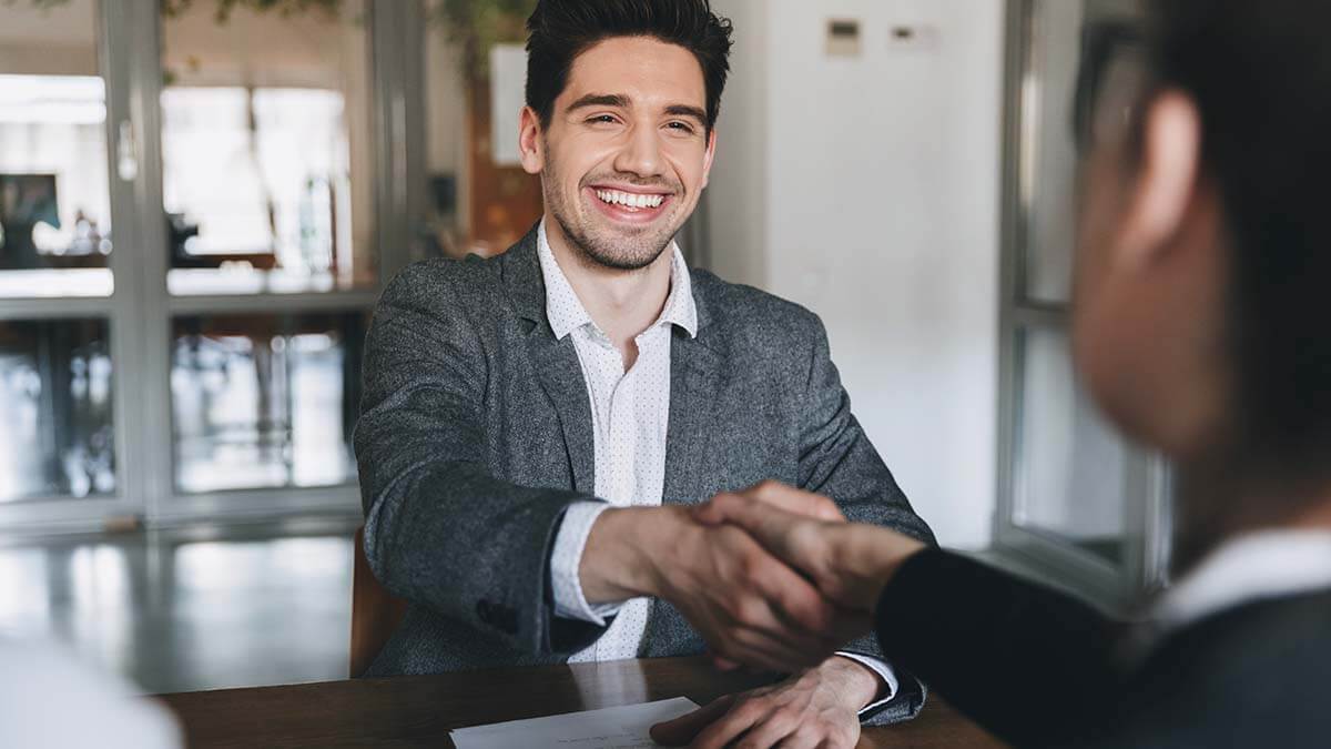 Two professionals shaking hands.