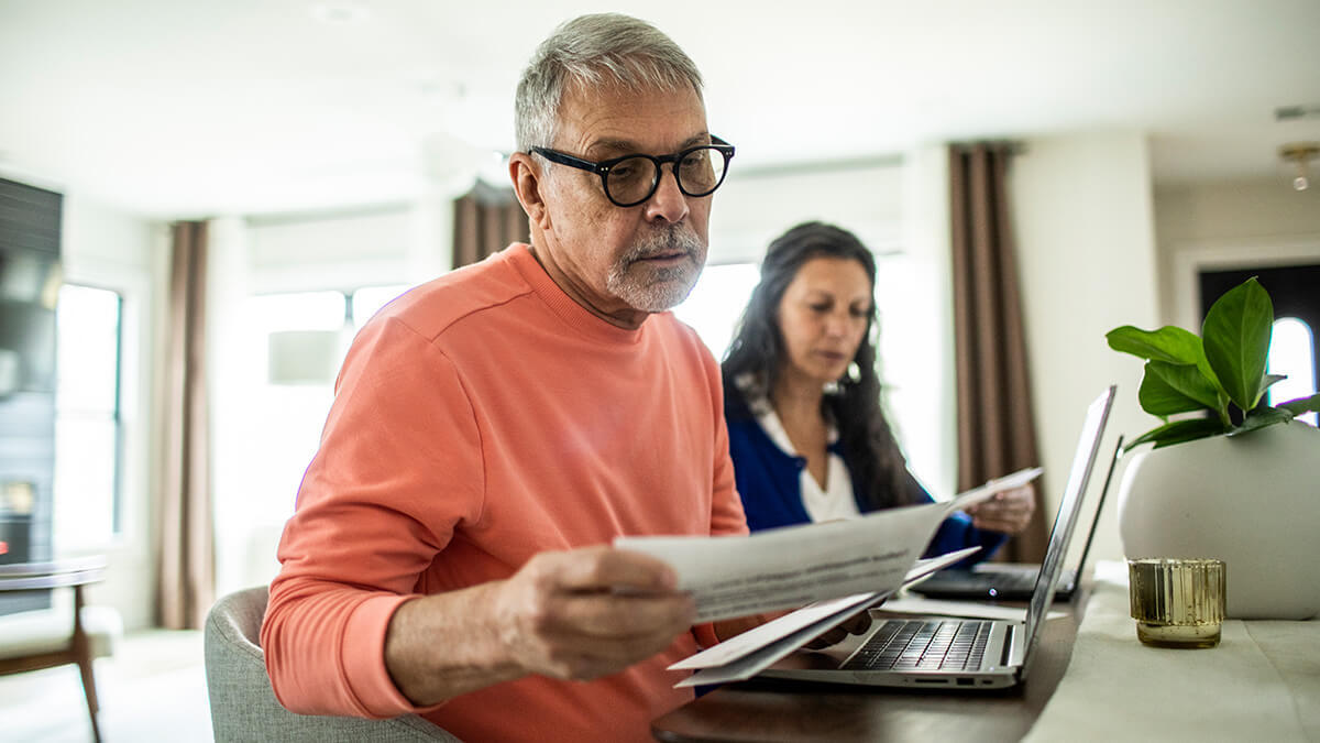 Husband and wife filling out filing status information.
