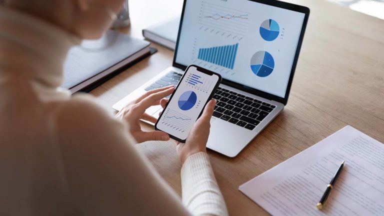 Business owner looking at a financial analyst report.