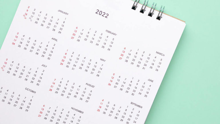 Annual calendar on a green background.
