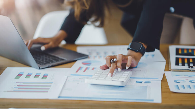 Business owner comparing fixed and variable costs.