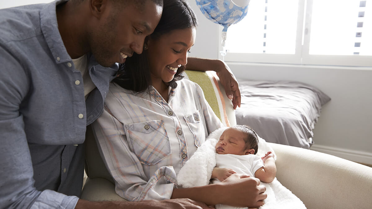 Husband and wife welcome new baby.