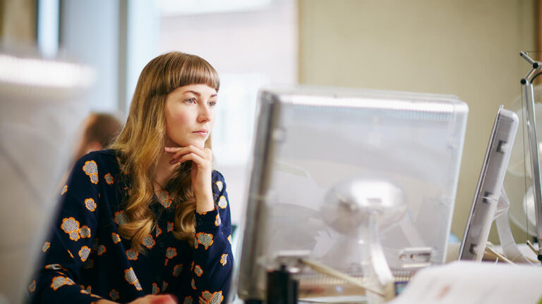 Woman looking at Form SS-8 online.