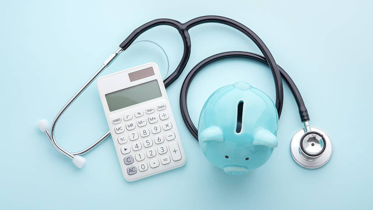 Piggy bank, calculator, and stethoscope.