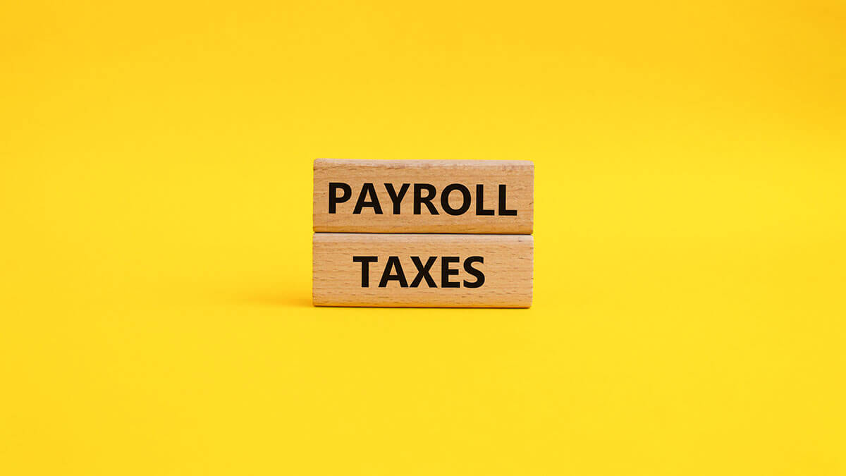 Wood blocks that says "Payroll Taxes."