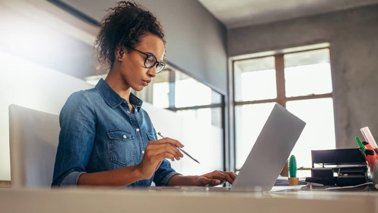 Woman filling out Form W-2 online.