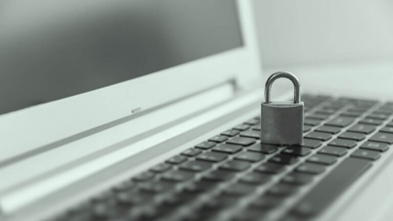 A lock on top of a laptop.