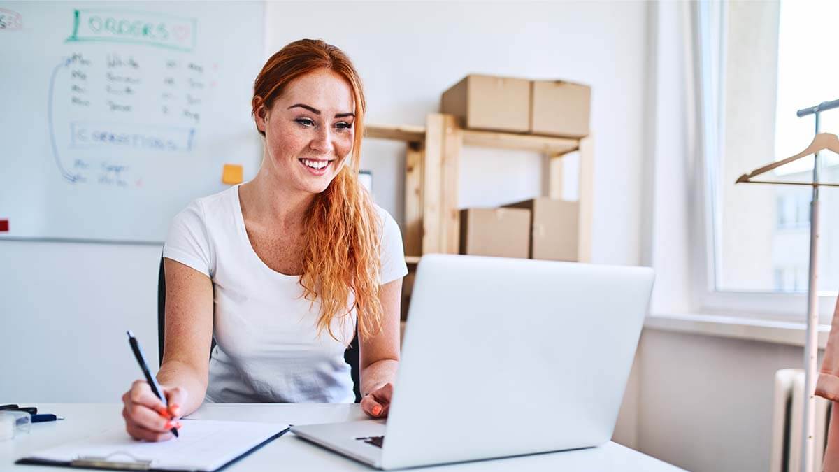 Smiling woman learning about ICHRA.