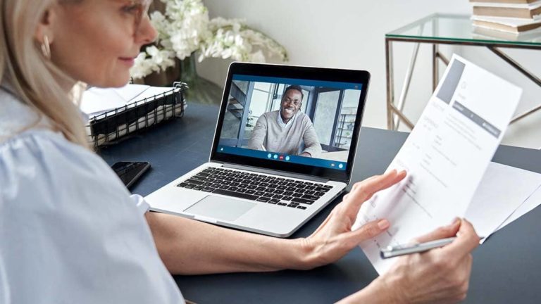 Woman conducting a virtual interview with a candidate.