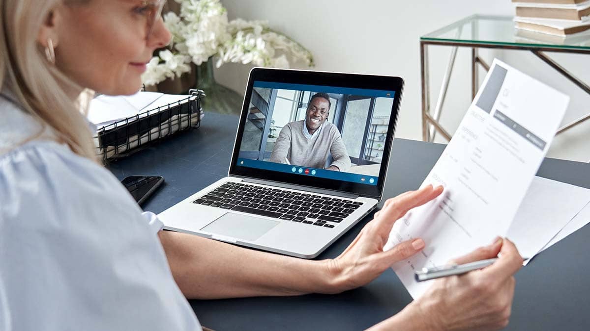 Woman conducting a virtual interview with a candidate.