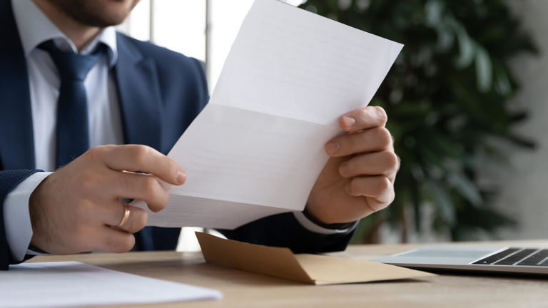Business owner reviewing lock-in-letter.