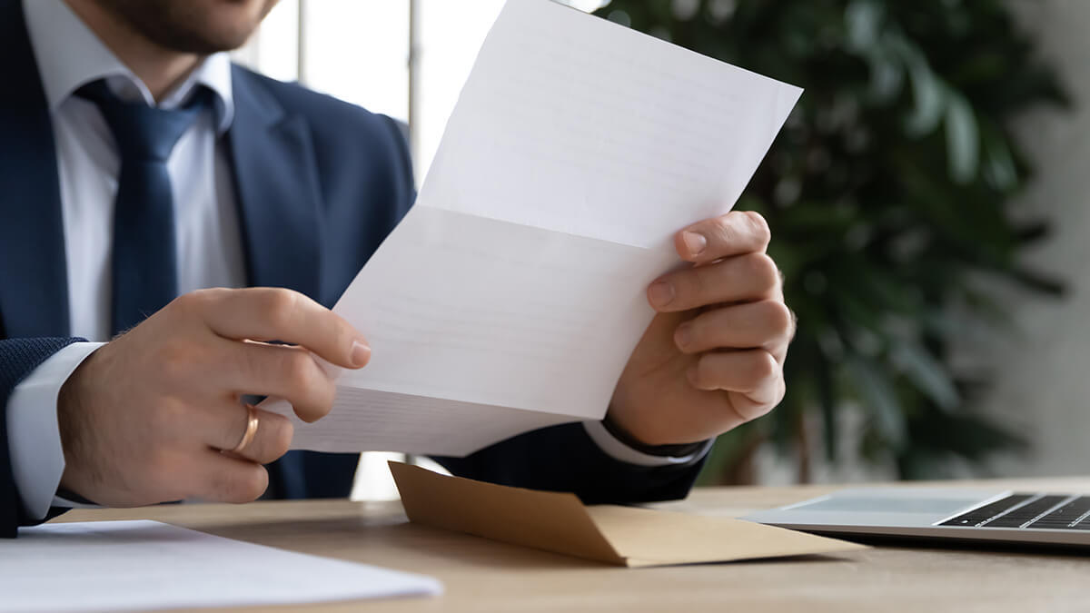 Business owner reviewing lock-in-letter.
