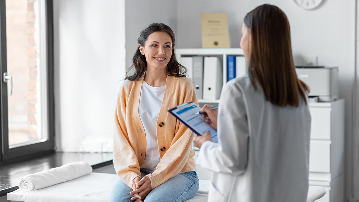Woman seeing her doctor.
