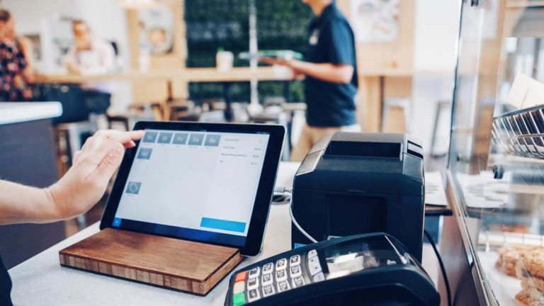 Cashier entering an order into point of sale system.