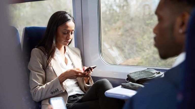 Two co-workers traveling on a train.