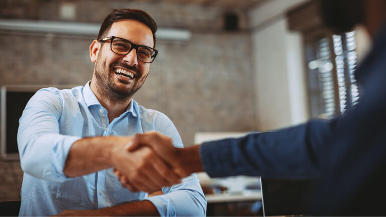 Two businessmen shaking hands.