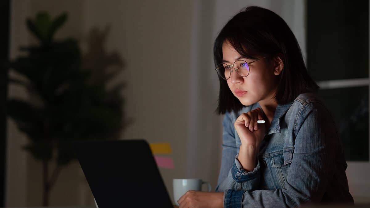Woman working overtime late at night.