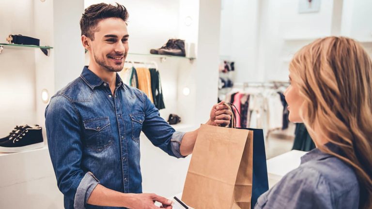 Customer paying for retail goods at the point of sale.