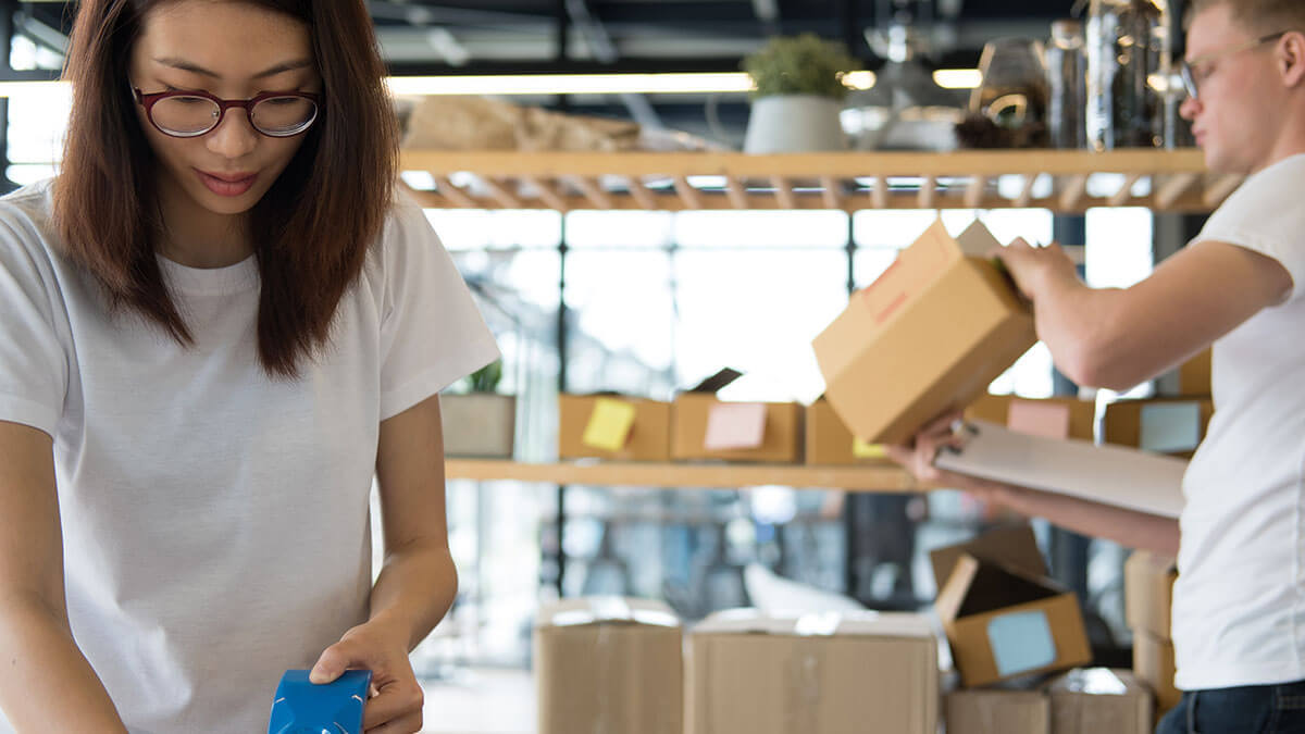 Employees handling shipping for small business.