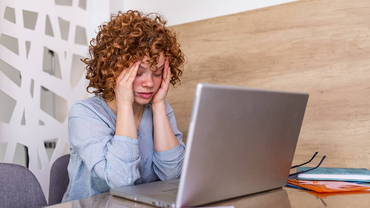 Sick employee with a headache.