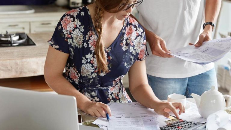 Man and woman doing paperwork.