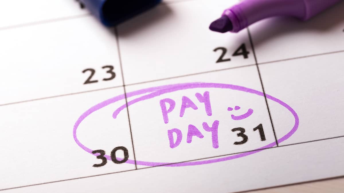 "Pay Day" written on a calendar and circled.