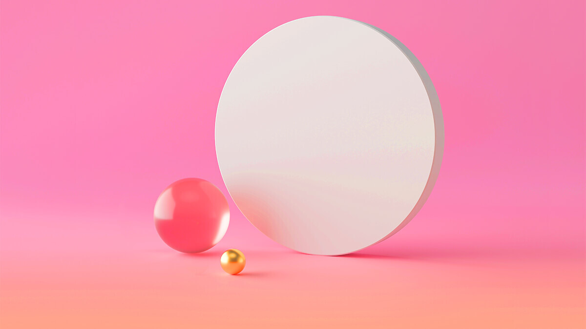 Three varying circles on a light pink background.