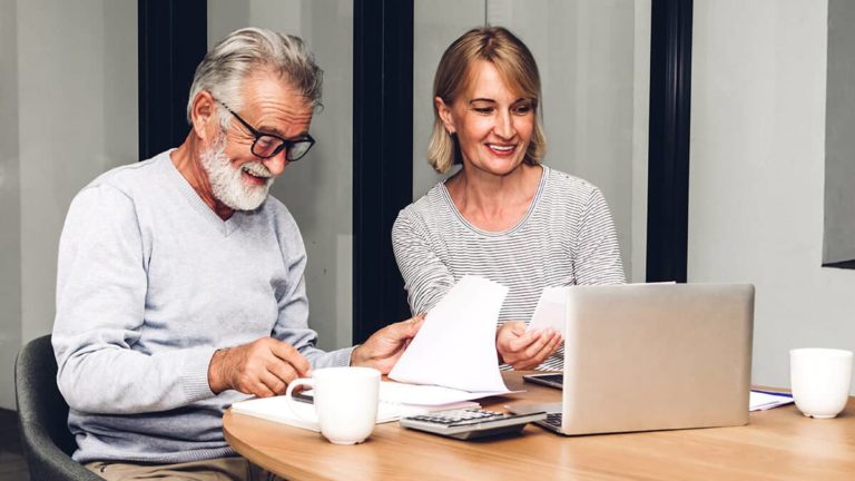 Man and woman reviewing paperwork.