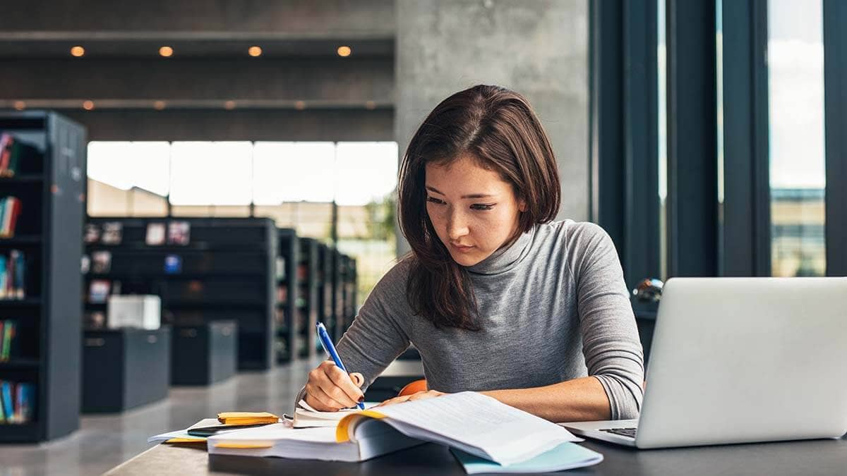 Woman filling out paperwork.