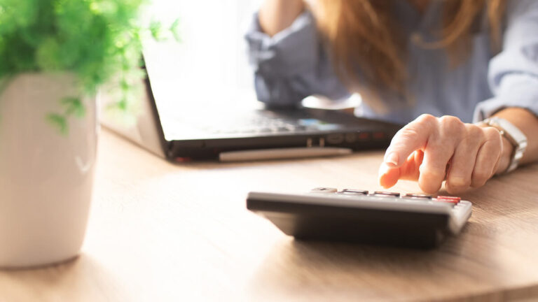 Woman using a calculator.