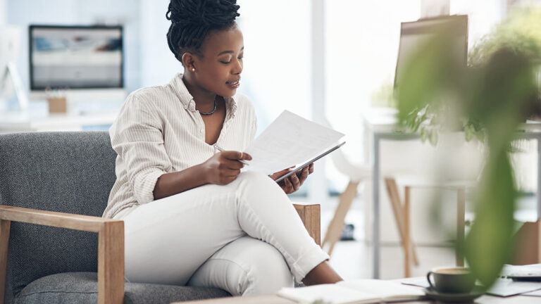 Woman reviewing Schedule A (Form 940).