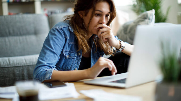Woman researching what is unemployment insurance.