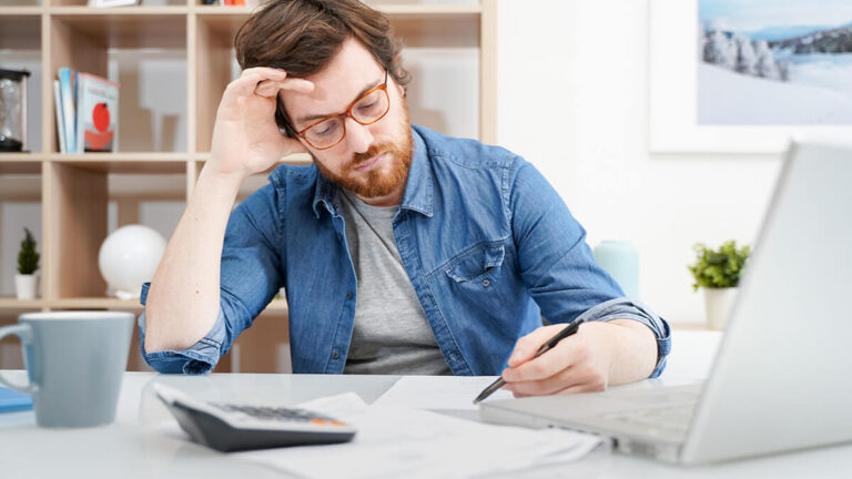 Stressed business owner writing off bad debt.