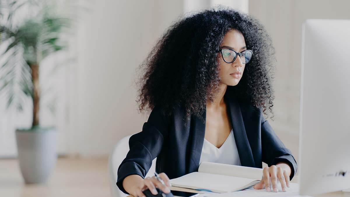 Woman reviewing year-to-date payroll earnings.