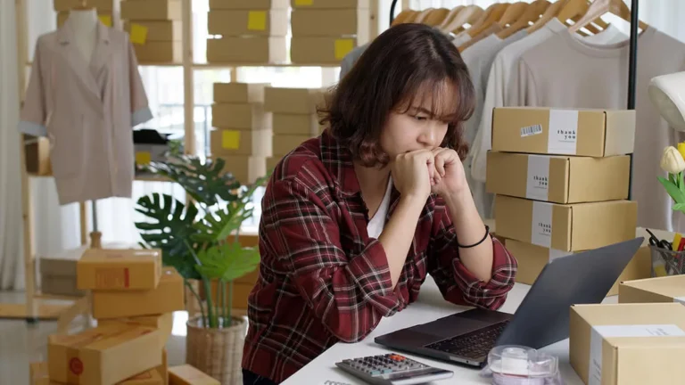 stressed woman looking at laptop
