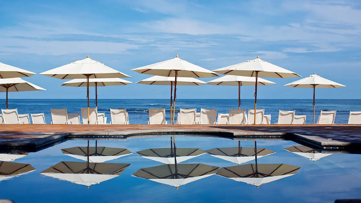 Umbrellas and chairs by a pool